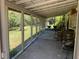 View from screen porch to an outdoor covered space and backyard at 24645 Ne 177Th Ter, Fort Mc Coy, FL 32134