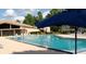 Large community pool with ample lounge seating at 3106 S Semoran Blvd # 5, Orlando, FL 32822