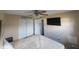 Inviting bedroom with ceiling fan, closet and TV at 346 Sand Pine Trl, Winter Haven, FL 33880