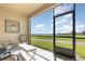 Relaxing screened lanai with comfortable seating provides panoramic views of the lush green landscape at 8938 Azalea Sands Ln # 1402, Davenport, FL 33896