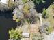 Aerial view of a lot surrounded by water and trees, offering a secluded setting at 9461 Cr 657, Bushnell, FL 33513