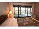 Bedroom with a view to an enclosed porch and water at 9461 Cr 657, Bushnell, FL 33513