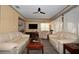 Living room area featuring hardwood flooring, comfortable seating and a tv at 9461 Cr 657, Bushnell, FL 33513