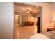 Living room with tile floors and a view to another room with a leather couch at 9461 Cr 657, Bushnell, FL 33513