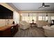 Comfortable living room with matching sofas, tv and luxury vinyl plank flooring at 9461 Cr 657, Bushnell, FL 33513