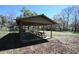 Community pavilion with picnic tables providing a shaded area for gatherings and outdoor enjoyment at 9461 Cr 657, Bushnell, FL 33513