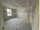 Unfinished bedroom showing drywall, window and concrete floor providing a blank canvas to create a personalized space at 222 Carpenters Way # 68, Lakeland, FL 33805