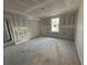 Bedroom with closet, window, fresh drywall, and unfinished floor is awaiting new owners at 222 Carpenters Way # 68, Lakeland, FL 33805