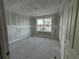 A bright bedroom with a window and fresh drywall is awaiting new owners at 222 Carpenters Way # 68, Lakeland, FL 33805