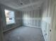 Modest bedroom featuring a window and newly installed drywall at 222 Carpenters Way # 68, Lakeland, FL 33805