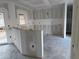 View of the space for a kitchen featuring modern appliances, a window, and a bar-like structure at 222 Carpenters Way # 68, Lakeland, FL 33805