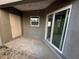 Outdoor lanai, featuring sliding glass doors and neutral color palette at 222 Carpenters Way # 68, Lakeland, FL 33805