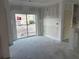 View of the space for living room featuring an open-concept and sliding door at 222 Carpenters Way # 68, Lakeland, FL 33805