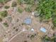 Aerial view of the property showing the house and surrounding land with lots of privacy and beautiful green trees at 15675 Sw 33Rd St, Ocala, FL 34481