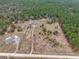 Aerial view of the homesite showing wooded area, pastures, and residences with an easement road at 15675 Sw 33Rd St, Ocala, FL 34481