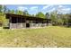 Rustic barn structure providing versatile space for storage or hobbies within a tranquil setting at 15675 Sw 33Rd St, Ocala, FL 34481