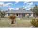 Charming single story home featuring a fenced yard with lush palms at 15675 Sw 33Rd St, Ocala, FL 34481