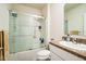 Well-lit bathroom with a shower-tub combination featuring sliding glass doors, and a single sink vanity at 2723 Elmbrooke Way, Edgewater, FL 32141