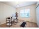 Bright bedroom features a desk area, natural light, and neutral carpeting at 2723 Elmbrooke Way, Edgewater, FL 32141
