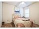 Inviting bedroom with a ceiling fan, a bed with a decorative throw, and a nightstand at 2723 Elmbrooke Way, Edgewater, FL 32141