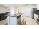 Well-equipped kitchen island with a sink, stainless steel dishwasher, and granite countertop at 2723 Elmbrooke Way, Edgewater, FL 32141