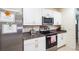 Kitchen featuring modern stainless steel appliances and granite countertops at 2723 Elmbrooke Way, Edgewater, FL 32141