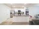 Modern kitchen features white cabinets, stainless steel appliances, and granite countertops at 2723 Elmbrooke Way, Edgewater, FL 32141