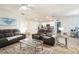 Bright living room with carpet, ceiling fan, and modern furniture at 2723 Elmbrooke Way, Edgewater, FL 32141