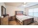 Main bedroom with stylish decor, ample natural light, and ceiling fan at 2723 Elmbrooke Way, Edgewater, FL 32141