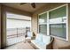 Cozy screened-in lanai with patio furniture offers peaceful outdoor living at 2723 Elmbrooke Way, Edgewater, FL 32141