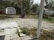 Backyard with mature trees and foliage at 4801 Avon St, Lake Wales, FL 33859