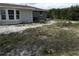 Backyard with mature trees and foliage at 4801 Avon St, Lake Wales, FL 33859