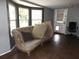 Living room featuring sofa, and a light-filled seating area with multiple windows at 4801 Avon St, Lake Wales, FL 33859