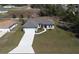 Aerial view of a single-Gathering home showcases landscaping and driveway at 524 Marion Oaks Blvd, Ocala, FL 34473