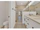 Bathroom featuring a glass shower and a dual vanity with modern fixtures at 524 Marion Oaks Blvd, Ocala, FL 34473