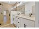 Modern bathroom with double vanity, quartz countertop, and glass-enclosed shower at 524 Marion Oaks Blvd, Ocala, FL 34473