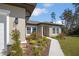 Charming front exterior with stone accents, lush landscaping, and a well manicured yard at 524 Marion Oaks Blvd, Ocala, FL 34473