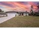 Charming single-story home featuring a well-manicured lawn, and a two-car garage at 524 Marion Oaks Blvd, Ocala, FL 34473