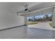 The interior of this garage features epoxy flooring and an open garage door at 524 Marion Oaks Blvd, Ocala, FL 34473