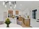 This modern kitchen features a center island, pendant lighting, and sleek, two-toned cabinetry at 524 S Marion Oaks Blvd, Ocala, FL 34473