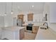 Kitchen showcasing quartz countertops, a stainless steel range, modern two-tone cabinets and recessed lighting at 524 Marion Oaks Blvd, Ocala, FL 34473