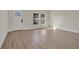 Bright living room with light wood-look floors and a door and windows to the exterior at 524 Marion Oaks Blvd, Ocala, FL 34473