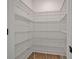 Walk-in pantry with metal shelving and ample storage space at 524 Marion Oaks Blvd, Ocala, FL 34473