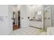 Hallway view into bathroom, shower, and vanity at 5261 Waterwood Dr, Bartow, FL 33830