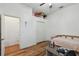 Bedroom with wood floors, closet, and a loft for extra storage at 5261 Waterwood Dr, Bartow, FL 33830