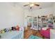 Bright and airy bedroom features hardwood floors, and ample shelving for decor at 5261 Waterwood Dr, Bartow, FL 33830
