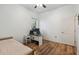 Bedroom with wood floors, neutral decor, and a window offering natural light at 5261 Waterwood Dr, Bartow, FL 33830