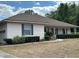 Charming single-story home featuring a covered front porch, well-maintained landscaping, and light-colored siding at 5261 Waterwood Dr, Bartow, FL 33830