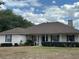 This charming single-story home offers a welcoming front porch, complemented by meticulously maintained landscaping at 5261 Waterwood Dr, Bartow, FL 33830