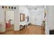 Bright foyer with hardwood floors, coat rack, a padded bench, and a double front door at 5261 Waterwood Dr, Bartow, FL 33830